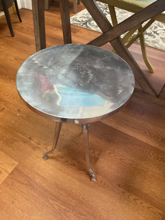 Metallic table on a wooden floor